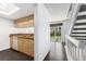 Well-lit kitchen featuring granite countertops, stainless sink, and access to a private backyard patio at 6011 Yarrow St # I, Arvada, CO 80004