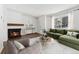 Cozy living room features a fireplace, modern furniture, and natural light for comfortable living at 6011 Yarrow St # I, Arvada, CO 80004
