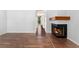 Elegant fireplace detail and wood-look floors create a warm and inviting atmosphere in this spacious home at 6011 Yarrow St # I, Arvada, CO 80004