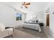 Bedroom featuring a ceiling fan, windows for ample light, and neutral toned walls at 6011 Yarrow St # I, Arvada, CO 80004