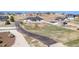 An aerial view displays a modern home with an extended driveway on a spacious lot at 10071 E 142Nd Ave, Brighton, CO 80602