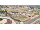 Aerial view of two homes on large lots showcases a white fence-lined property and expansive surrounding landscape at 10071 E 142Nd Ave, Brighton, CO 80602