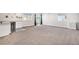 Finished basement with carpet flooring, lots of lighting, and multiple windows for natural light at 10071 E 142Nd Ave, Brighton, CO 80602