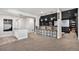 Finished basement with a bar, kitchenette, and custom theatre area at 10071 E 142Nd Ave, Brighton, CO 80602