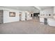 Finished basement with bar area, carpet flooring, and an open layout at 10071 E 142Nd Ave, Brighton, CO 80602
