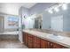 Bathroom featuring double sinks, soaking tub, and tile flooring at 10071 E 142Nd Ave, Brighton, CO 80602