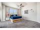 Bedroom featuring a ceiling fan, vaulted ceiling, and windows offering natural light at 10071 E 142Nd Ave, Brighton, CO 80602