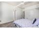 Bright bedroom showcasing a four-poster bed and multiple closet access points at 10071 E 142Nd Ave, Brighton, CO 80602