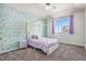 Whimsical bedroom featuring a four-poster bed and colorful accent wall at 10071 E 142Nd Ave, Brighton, CO 80602