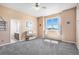 Spacious bedroom with natural light, carpet, neutral color palette, and ensuite bathroom at 10071 E 142Nd Ave, Brighton, CO 80602