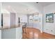 Bright breakfast nook features a bay window, hardwood floors, and views of the backyard at 10071 E 142Nd Ave, Brighton, CO 80602