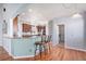 Spacious kitchen featuring hardwood floors, granite countertops, stainless appliances, and an open layout at 10071 E 142Nd Ave, Brighton, CO 80602