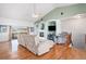 Spacious living room featuring vaulted ceilings, a fireplace, hardwood floors, and large windows at 10071 E 142Nd Ave, Brighton, CO 80602
