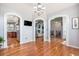 Open concept living area showcasing hardwood floors and arched doorways to other rooms at 10071 E 142Nd Ave, Brighton, CO 80602