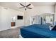 Spacious main bedroom boasting an ensuite bathroom and private access to outdoor deck at 10071 E 142Nd Ave, Brighton, CO 80602