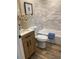 Stylish bathroom with modern fixtures, vanity, and blue tiled shower showcasing a clean and contemporary design at 794 W Elati Cir, Littleton, CO 80120