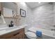 Charming bathroom with a vanity with a white countertop, decorative vase and shower-bath with tiled wall at 794 W Elati Cir, Littleton, CO 80120