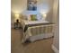 Comfortable bedroom featuring neutral tones, a bed with decorative pillows, and soft lighting, creating a relaxing atmosphere at 794 W Elati Cir, Littleton, CO 80120