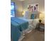Cozy bedroom featuring bright window, plush bedding, modern art, and stylish side tables for a relaxing retreat at 794 W Elati Cir, Littleton, CO 80120