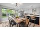 Spacious dining area with a view of the backyard, open to the kitchen at 794 W Elati Cir, Littleton, CO 80120