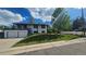 Charming two-story home with well-manicured lawn, inviting curb appeal, spacious garage, and sunny front yard at 794 W Elati Cir, Littleton, CO 80120