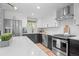 Well-appointed kitchen with stainless steel appliances, quartz countertops, and modern cabinetry at 794 W Elati Cir, Littleton, CO 80120