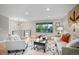 Cozy living area with comfortable seating, a large window, and neutral decor at 794 W Elati Cir, Littleton, CO 80120