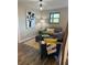 Stylish living room with hardwood floors, modern lighting, comfortable seating, and artistic decor for cozy gatherings at 794 W Elati Cir, Littleton, CO 80120