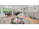 Bright living room with an open layout, hardwood floors, and modern furnishings at 794 W Elati Cir, Littleton, CO 80120