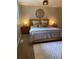 Cozy bedroom featuring a plush bed with decorative pillows, soft lighting, and a neutral color palette at 794 W Elati Cir, Littleton, CO 80120