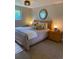Comfortable bedroom with a well-lit space offering a bed with decorative pillows and neutral tones for a peaceful ambiance at 794 W Elati Cir, Littleton, CO 80120