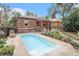A refreshing in-ground pool in a private backyard with a patio and garden at 1423 Dahlia St, Denver, CO 80220