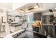 A kitchen featuring stainless steel appliances, unique cabinetry, and a functional layout at 1423 Dahlia St, Denver, CO 80220