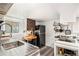 Well-lit kitchen featuring stainless steel sink and appliances, complemented by modern cabinetry at 1423 Dahlia St, Denver, CO 80220