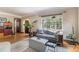Cozy living room with hardwood floors, large windows, and stylish furnishings at 1423 Dahlia St, Denver, CO 80220