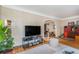 Open living room view showcasing hardwood floors and connecting spaces at 1423 Dahlia St, Denver, CO 80220