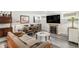 Inviting living room featuring hardwood floors, modern décor, and comfortable seating near a fireplace at 1423 Dahlia St, Denver, CO 80220