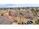 Aerial view of a townhome community with mature trees and well-maintained landscaping at 11689 Elk Head Range Rd, Littleton, CO 80127