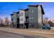 Contemporary townhome featuring modern architecture and neutral exterior colors at 8400 W 52Nd Ave, Arvada, CO 80002