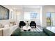 Bright and airy living room features modern decor, comfortable seating, and lots of natural light at 8400 W 52Nd Ave, Arvada, CO 80002