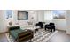 Bright and airy living room features modern decor, comfortable seating, and lots of natural light at 8400 W 52Nd Ave, Arvada, CO 80002