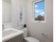 Contemporary half-bath featuring modern fixtures and ample natural light at 8400 W 52Nd Ave, Arvada, CO 80002