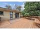This home has a back deck with built-in seating and lots of shade at 7264 S Platte Canyon Dr, Littleton, CO 80128
