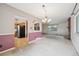 Living room featuring brick fireplace and access to kitchen at 7264 S Platte Canyon Dr, Littleton, CO 80128