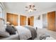 Stylishly furnished main bedroom offering ample closet space and an ensuite bathroom at 7264 S Platte Canyon Dr, Littleton, CO 80128