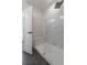 Modern walk-in shower featuring marble tile and glass door at 8530 W 52Nd Ave # C2, Arvada, CO 80002