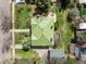 Bird's-eye view of a beautiful property showcasing a lush, green roof, a well-maintained lawn, and mature trees at 1317 Birch St, Denver, CO 80220