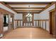 Elegant dining room features hardwood floors, wood trim, coffered ceiling, and a stylish chandelier at 1317 Birch St, Denver, CO 80220