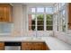 Kitchen sink with a view of the outdoors through multiple windows at 1317 Birch St, Denver, CO 80220