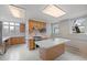 Spacious kitchen with an island, oak cabinets, and large windows at 1317 Birch St, Denver, CO 80220